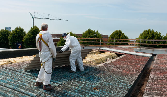 Expert team performing asbestos abatement