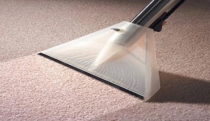 Carpet cleaning using vacuum.