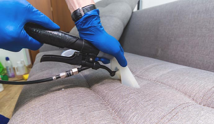 Upholstery cleaning using equipment.