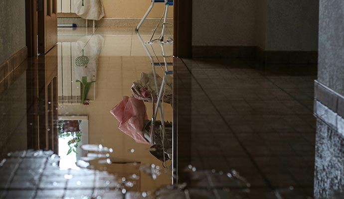 Flooded tiled floor in room