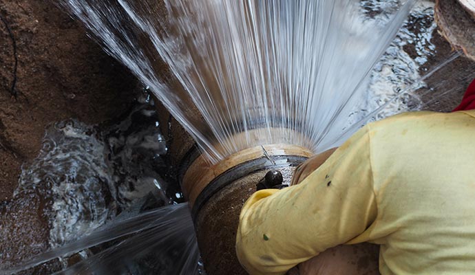 Expert repairing leak water pipe.